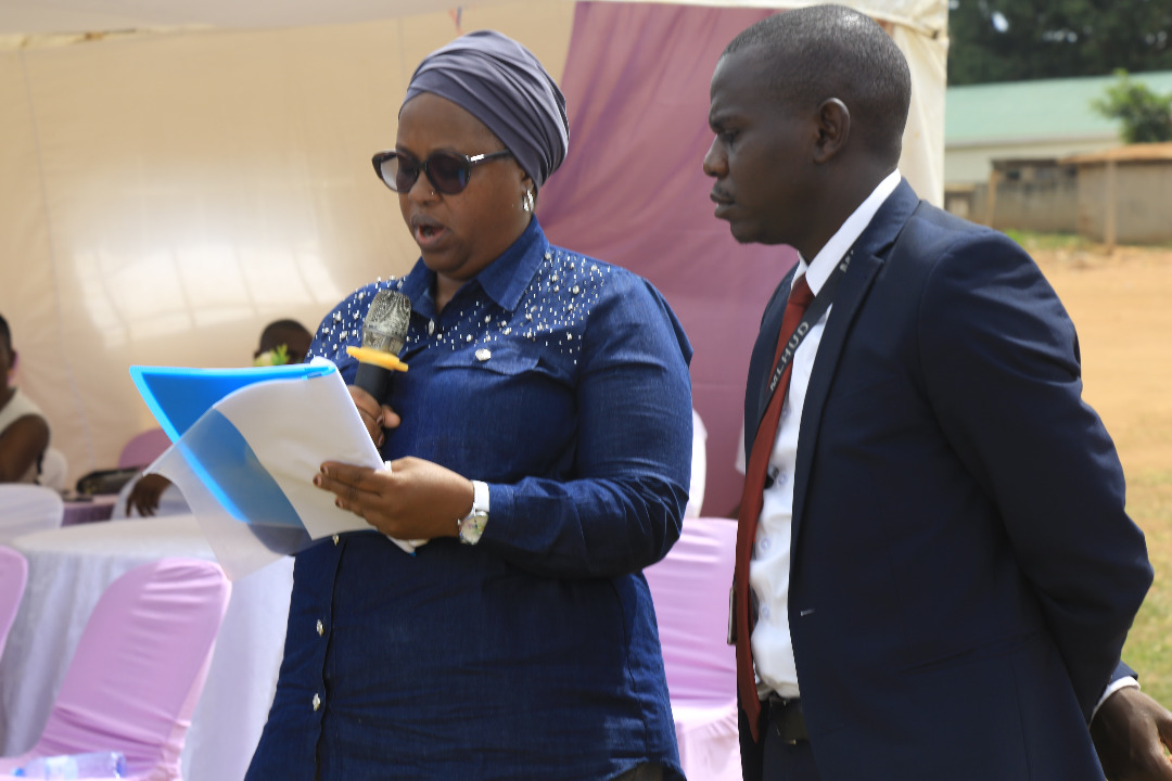 Ms. Aisha Kabira reading Lands minister Hon. Judith Nabakooba's speech